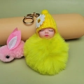 Cute yellow plush pom pom baby doll keychain with knitted daisy hat and golden clasp - Yellow