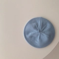 Detailed close-up of light blue knit baby beret showing soft textured yarn and top stem - 45-48cm (6 Months-3 Years) / Creamy Blue