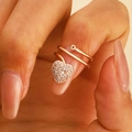 Close-up of a rose gold heart pendant fingernail ring with shimmering pavé-set crystals - Pave Zirconia Heart Pendant Ring (4790)