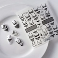 Detailed macro view of 5D embossed black lace underwear nail stickers on white tips - 5D White Lace Underwear Style (FEB-342)