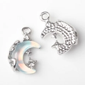 Macro view of silver crescent moon and star pendant with opal inlay and clear zircons - Silver Base Green