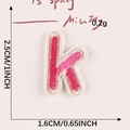 Rose pink embroidered letter K patch with beige border and self-adhesive backing - Letter-K
