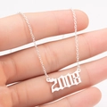 Detail of silver year 2008 pendant necklace featuring gothic font and O-ring chain - 2008 / Steel