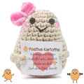 Detail of handmade crochet potato doll with pink bow and German positive quote card - Potato with Pink Bow
