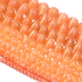 Detailed view of orange cat eye stone round beads in various sizes for DIY jewelry - 6mm (Approx 60pcs) / Dark Champagne