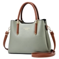 Green and brown two-tone crossbody handbag with gold hardware and top handle - Cyan