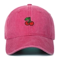Close-up of cherry embroidery and washed cotton texture on the magenta baseball cap - Rose Red