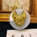 Detailed view of a gothic golden bat head sculpture with metallic finish on a round base - No. 4-Devil Bat Cat