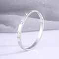 Silver four-leaf clover bangle with zircon stones and polished steel finish - Clover Bangle / Silver