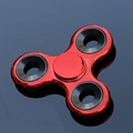 Three-leaf metal fidget spinner in red finish with black weights on dark reflective surface - Electroplated Red with Iron Weight