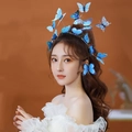 Asian model wearing a blue tiered 3D butterfly headband with realistic layered wings - Blue Butterfly Headband (Full Ring)