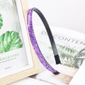 Detail view of purple glitter headband with shiny sequins on a minimalist background - Purple