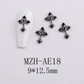 Close-up of gunmetal gothic cross nail charms with black rhinestones for nail art - Gothic Black Stone Cross (AE18)