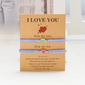 Braccialetti intrecciati con cuore viola e blu su cartoncino kraft per innamorati - Blu e Viola - Set di 2