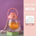 Close-up of peach pink 1300ml water bottle with striped strap and time marker details - 1300ml Pink Single Drink Style