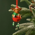 Christmas reindeer bell ornament with red hat and star cutout hanging on snowy pine branch - Boots Cane Reindeer-Red Bell-Full Body