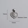 Detail view of heart-shaped stainless steel pendant with angel relief, 15mm x 15mm size - Cupid Relief Heart Pendant (P00024S)