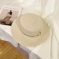 Beige woven straw boater hat with black ribbon and gold M detail on fabric backdrop - Beige Metal M Black Band