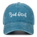 Close-up of vintage blue washed denim baseball cap with white Bad Bitch embroidery detail - Lake Blue