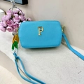 Sky blue textured faux leather crossbody bag with golden P hardware and colorful chain strap - Blue