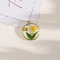 Golden round resin pendant with yellow dried flowers and green leaves for DIY jewelry - Style 22