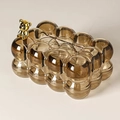 Brown bubble texture tissue box featuring a metallic gold bear ornament on the lid - With Bear + Bow / Amber