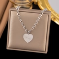 Silver heart pendant necklace with radial texture in a brown gift jewelry box - Ray Heart / Steel