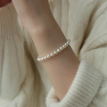 Elegant white pearl beaded bracelet worn on wrist for a minimalist luxury fashion look - White 6mm Pearl Beaded (MY31469 6mm)