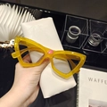 Retro triangle cat eye sunglasses featuring transparent yellow frames and clear lenses - Yellow