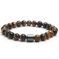 Tiger eye stone beaded bracelet with 8mm round beads and a black metal cylinder accent - Tiger Eye Stone Bracelet