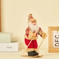 Christmas Santa plush figure with wooden skis and poles in a red velvet suit and plaid trim - Skiing Style (Red & Brown Plaid)