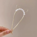 Cat ear metal hair stick with white pearls and rhinestones shown in hand - 186# Gold Cat Ear Pearl Hairpin