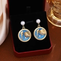 Macro detail of French vintage conch and pearl flower earring in a luxury gift box - Sky Blue Shell Pearl Dangle