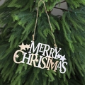 Detail of wooden Merry Christmas sign hanging on pine branch with stars and rustic twine - White Wood Splicing - Star Decoration