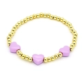 Detailed shot of golden beaded bracelet featuring three light purple enamel hearts - Light Purple