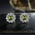 Sunflower stud earrings featuring yellow round zircon centers and white diamond halo finish - Olive Green