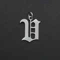 Detailed view of a silver Gothic letter V pendant made of polished stainless steel - Letter V