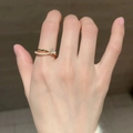 Golden butterfly ring with pearl accents shown on model hand for elegant styling - Pearl Butterfly