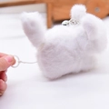 Mini white plush cat keychain with pull-string vibrator and small silver metal bell - Wagging Tail Style / White