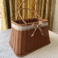 Dark brown woven picnic basket with white lace trim and burlap pearl bow accent - T-shape Hemp Rope Pearl Bottom Basket 26x18x16cm