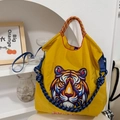 Detail of vibrant tiger head embroidery on a yellow nylon tote bag with braided handles - Yellow Tiger - New (Without Shoulder Strap)