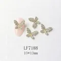 Detailed view of 10x13mm gold butterfly nail art charms with micro-pave crystals - Gold White Rhinestone 3D Butterfly (7188)