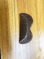 Handcrafted sandalwood hair comb featuring detailed wing carving in deep brown wood - Black Gold Sandalwood Angel Wings