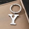 Polished silver metal letter Y keychain with a large split ring on a textured gift box - Letter Y