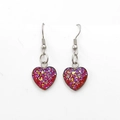 Detail of heart-shaped earrings with red glitter finish and stainless steel hooks - Red (Color 3)