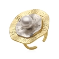 Detailed macro of gold and silver textured metal petals with a white pearl on a ring - Round Flower Open Ring / Gold Round Flower Pearl