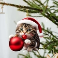 Detail of tabby cat ornament with red Christmas hat hanging on festive tree branches - Cat 3