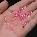 Pink translucent glass seed beads for DIY jewelry making held in a person's palm - 4mm / 15g / Light Pink