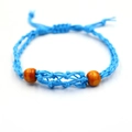 Handmade sky blue braided bracelet featuring two natural brown wooden beads with sliding knot - Bracelet / Sky Blue