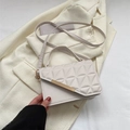 White quilted crossbody bag with gold metal trim and slim shoulder strap for women - White